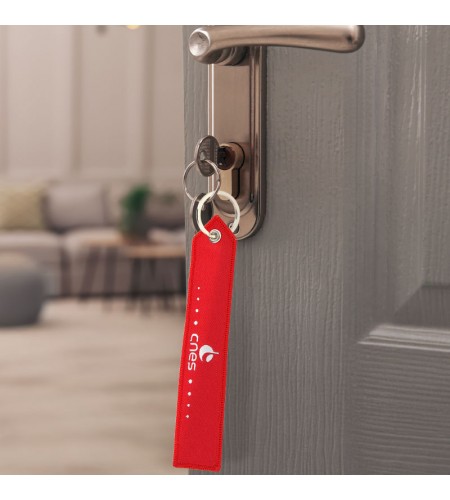 Porte-clés rouge CNES "Remove before...